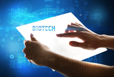 BIOTECH yazıtlı el işi fütüristik tablet, yeni teknoloji kavramı