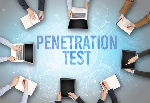 Group of people in front of a laptop with PENETRATION TEST insciption, web security concept