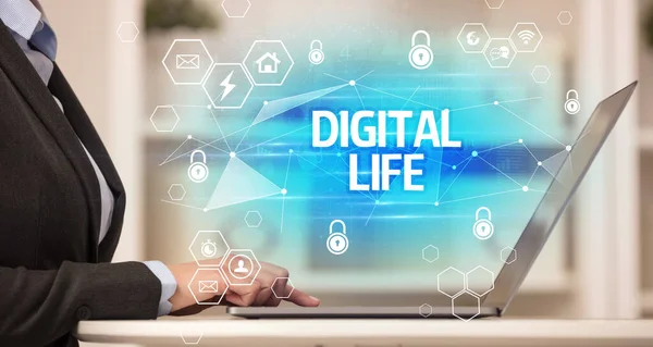 DIGITAL LIFE inscription on laptop, internet security and data protection concept, blockchain and cybersecurity