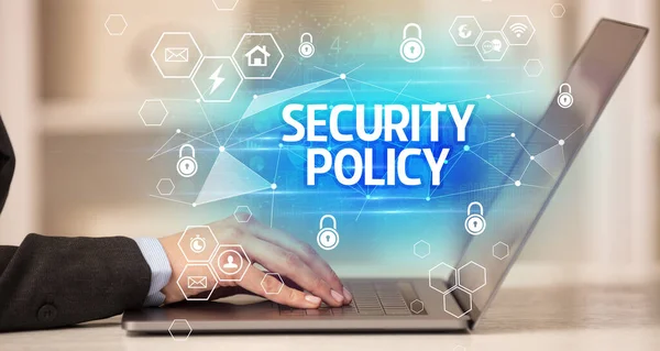SECURITY POLICY inscription on laptop, internet security and data protection concept, blockchain and cybersecurity