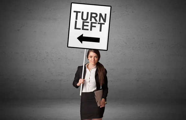 Бізнесмен Який Тримає Дорожній Знак Написом Turn Left Нова Концепція — стокове фото
