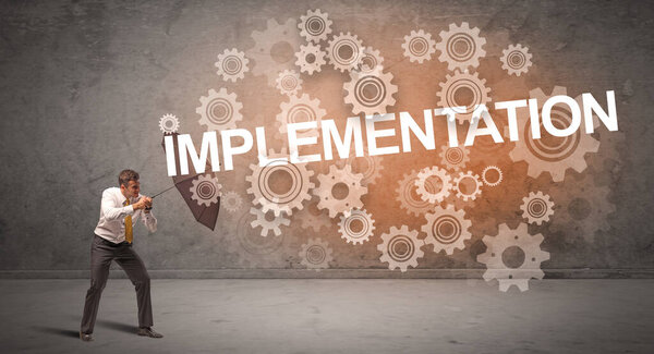 Бизнесмен, защищающийся зонтиком от имплантации, технологическая концепция