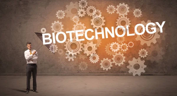 Бизнесмен Защищающийся Зонтиком Надписи Biotechnology Технологической Концепции — стоковое фото
