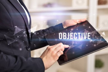 OBJECTIVE yazıtları ve modern iş teknolojisi kavramı ile elleri kapat