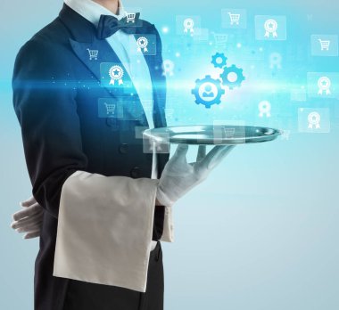 Genç garson tepside vites simgeleri sunuyor, yeni iş modeli konsepti