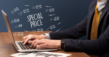 Businessman working on laptop with SPECIAL PRICE inscription, online shopping concept