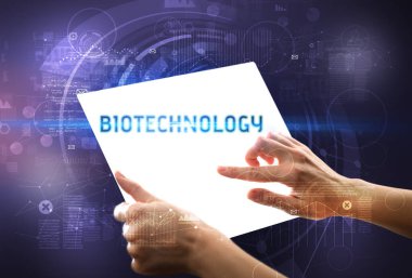 BIOTECHNOLOGY yazıtlı el işi fütüristik tablet, yeni teknoloji kavramı