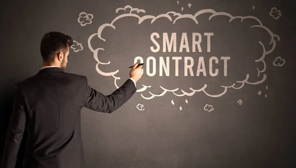 businessman drawing a cloud with SMART CONTRACT inscription inside, modern business concept