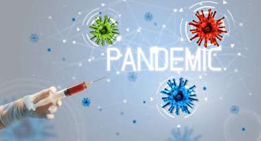 Şırınga, elinde PANDEMIC yazısıyla tıbbi enjeksiyon, koronavirüs aşısı konsepti