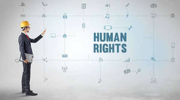 Engineer working on a new social media platform with HUMAN RIGHTS inscription concept