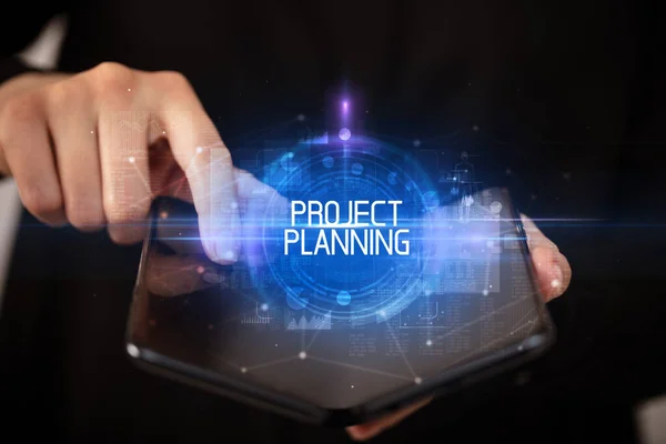 Young Man Holding Foldable Smartphone Project Planning Inscription Educational Concept — Stock Photo, Image
