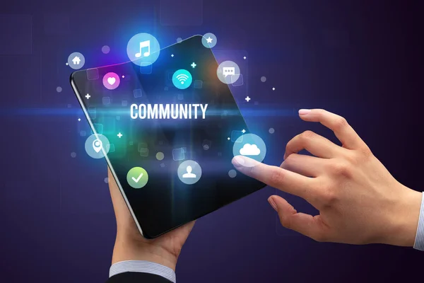 Businessman Holding Foldable Smartphone Community Inscription Social Media Concept — Stock Photo, Image