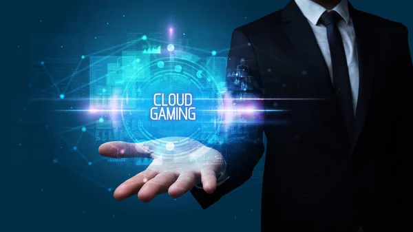 Man hand holding CLOUD GAMING inscription, technology concept
