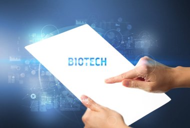 BIOTECH yazıtlı el işi fütüristik tablet, yeni teknoloji kavramı