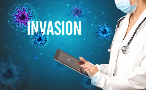 doctor prescribes a prescription with INVASION inscription, pandemic concept