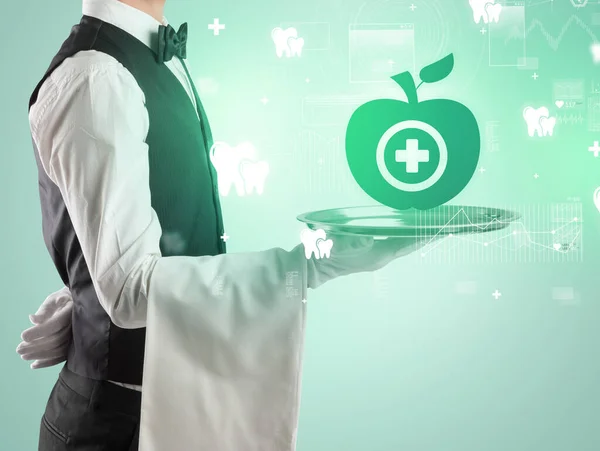 Przystojny Młody Kelner Smokingu Trzymający Tacę Zdrowymi Ikonami Jabłek Tacy — Zdjęcie stockowe