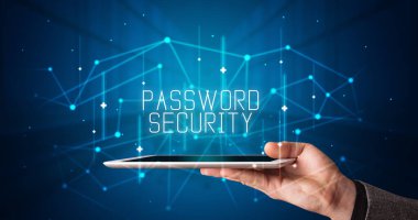Tablet üzerinde çalışan genç iş adamı dijital işareti gösteriyor: PASSWORD GÜVENLİĞİ