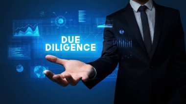 İş adamının elinde Diligence yazıtları, iş başarısı kavramı var.