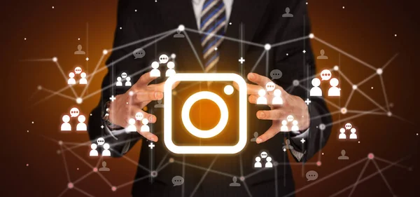 Hand holdig camera icon around his hands, Social networking concept