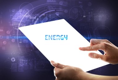 El işi fütüristik tablet içinde ENERGY yazıtları, yeni teknoloji kavramı