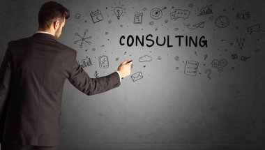 businessman drawing a creative idea sketch with CONSULTING inscription, business strategy concept
