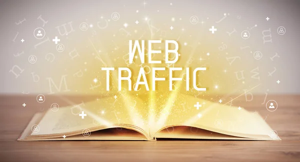 Open book with WEB TRAFFIC inscription, social media concept