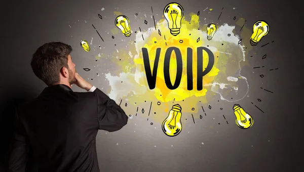 Business Man Drawing Colorful Light Bulb Voip Abbreviation New Technology — стоковое фото