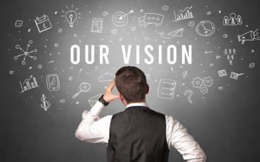 VISION yazıtlarımıza sahip bir işadamının arka görünüşü, modern iş kavramı