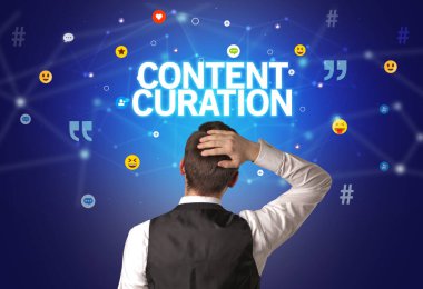 Rear view of a businessman with CONTENT CURATION inscription, social networking concept clipart