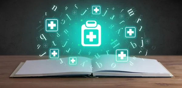Open medical book with first aid kit icons above, global health concept