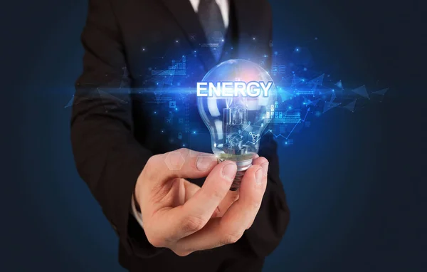 Бизнесмен Держит Лампочку Надписью Energy Концепция Инновационных Технологий — стоковое фото
