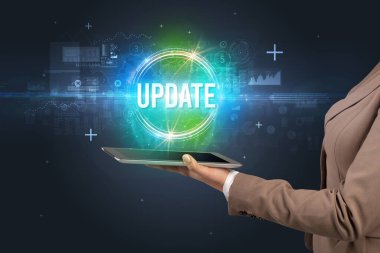 UPDATE yazıtı ve yeni teknoloji konseptiyle dokunmatik ekranın yakın plan görüntüsü