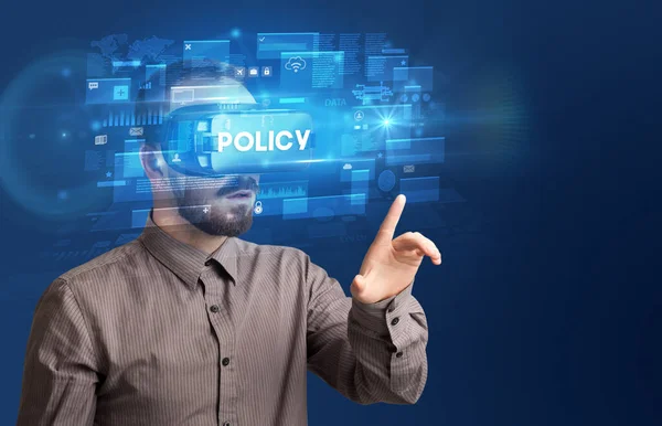 Hombre Negocios Mirando Través Gafas Realidad Virtual Con Inscripción Política —  Fotos de Stock