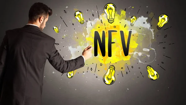 businessman drawing colorful light bulb with NFV abbreviation, new technology idea concept
