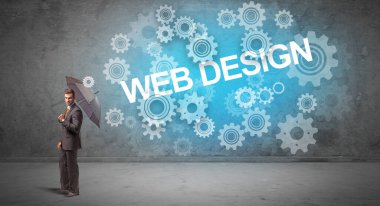 WeB DESIGN yazıtları ve teknoloji kavramından şemsiyeyle savunma yapan iş adamı