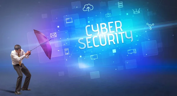 サイバー攻撃やサイバーセキュリティの碑文から傘で守るビジネスマン オンラインセキュリティの概念 — ストック写真