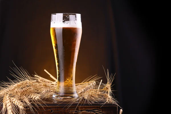 Glass of beer on a chest — Stock Photo, Image