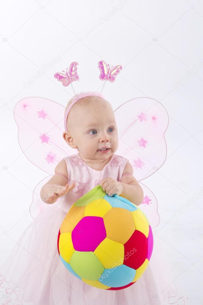 Happy baby play with the soft soccer ball