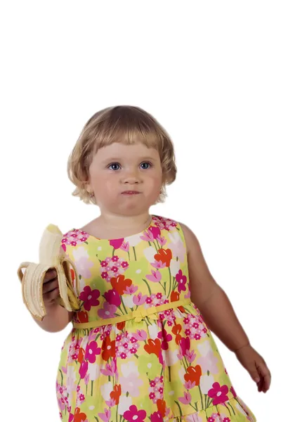 Porträtt av en liten flicka som äter banan — Stockfoto