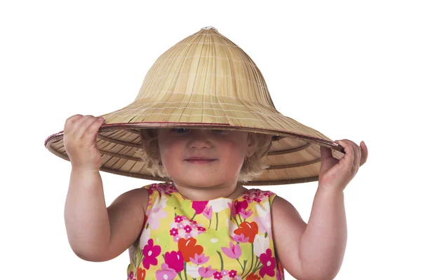 A child in a straw hat on a white background — Stock Photo, Image