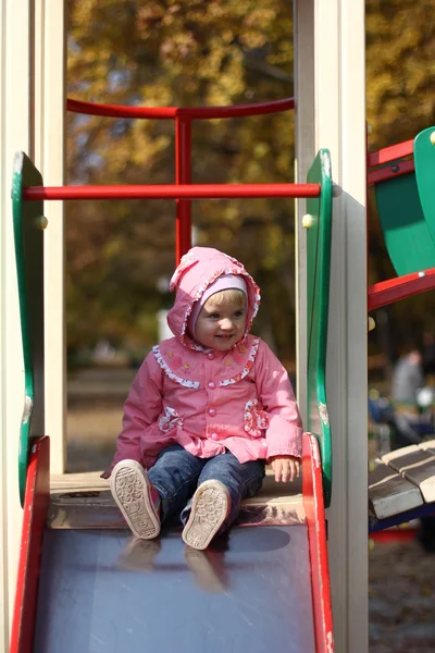 Menina no parque infantil — Fotografia de Stock