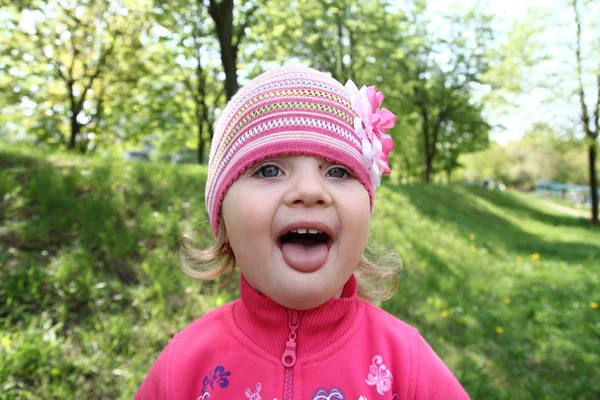 Little girl shows tongue — Stock Photo, Image