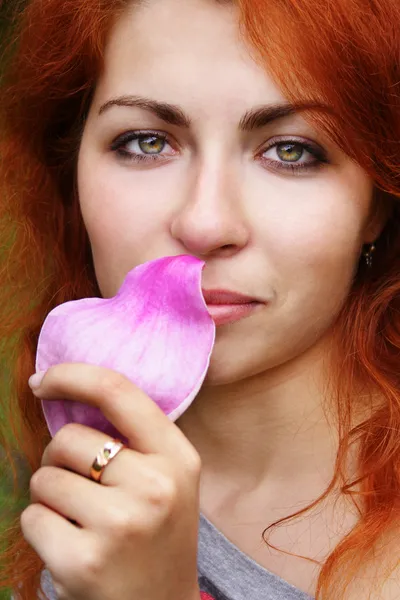 Smelling a petal — Stock Photo, Image