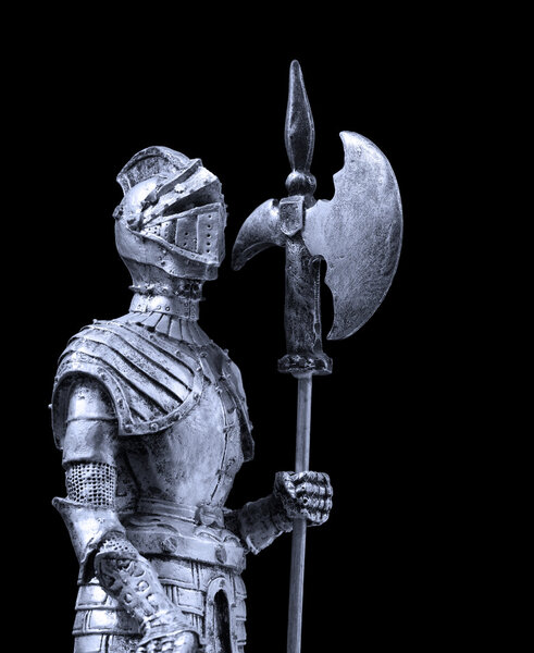 A knight dressed with full plate mail and armed with a halberd