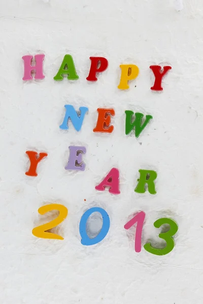 Colorful character made from resin Happy New Year put word — Stock Photo, Image