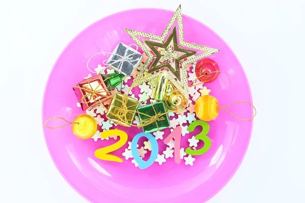 Colorful character Happy New Year greetings in plastic dishes — Stock Photo, Image