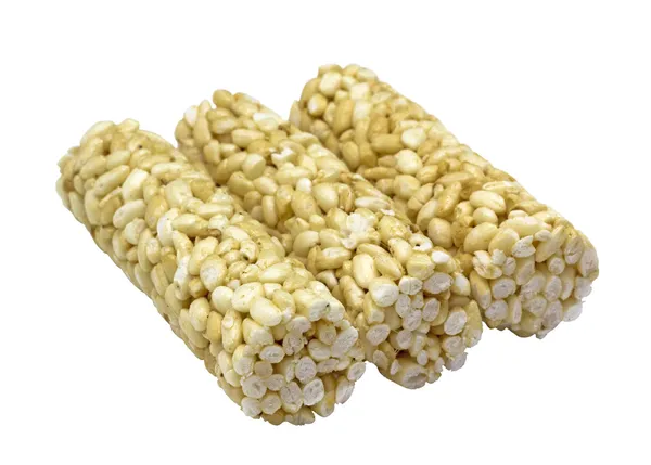 Puffed rice in honey on a white background — Stock Photo, Image