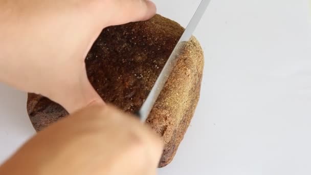 Sliced dark bread pieces, on white background — Stock Video