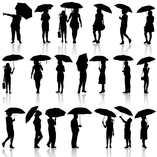Conjunto de siluetas negras de hombres y mujeres con paraguas. Vector — Vector de stock