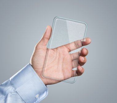 Blank futuristic smart phone in hand clipart